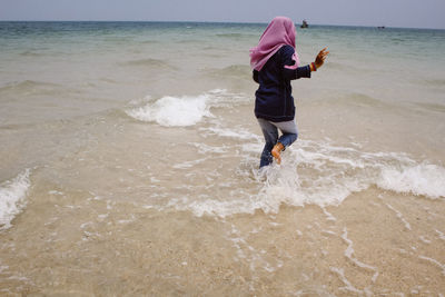 Full length of boy on beach