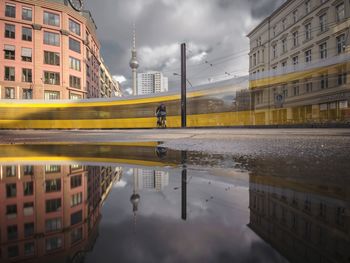 Reflection of buildings in puddle