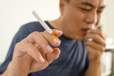 Close-up of man smoking