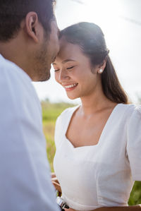 Side view of young woman looking away