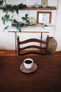 High angle view of coffee cup on table at home