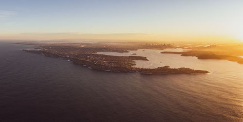 High angle view of sea against sky during sunset