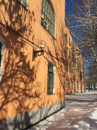 Street amidst buildings during winter