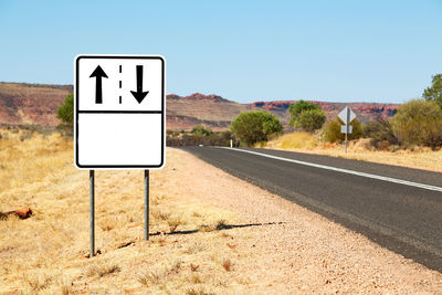 Information sign on road against clear sky