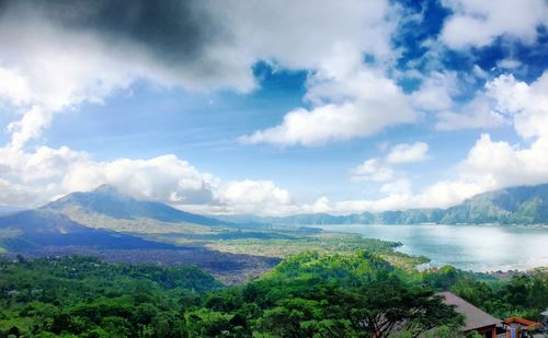 Scenic view of mountains against cloudy sky