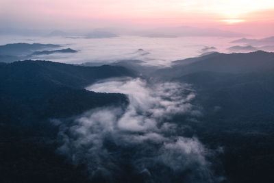 Aerial view of mountains against sky during sunset