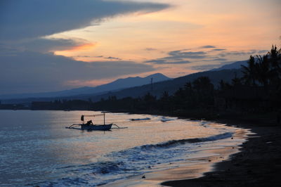 Scenic view of sea at sunset