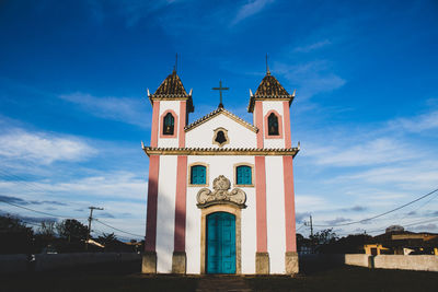 Low angle view of church against blue sky