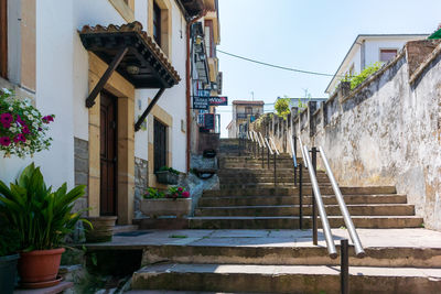 Rear view of woman walking on staircase