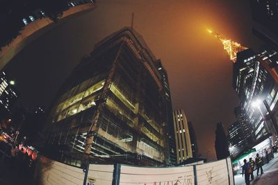 Illuminated city street at night