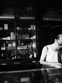 Full length of man standing in store