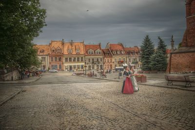 View of buildings against cloudy sky