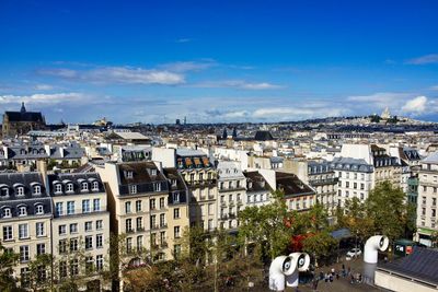 Above the roofs of paris, france - sacre coeur in the right far background