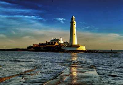 High tide covers the causeway to st. mary's island, england