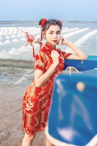 Young woman standing at beach