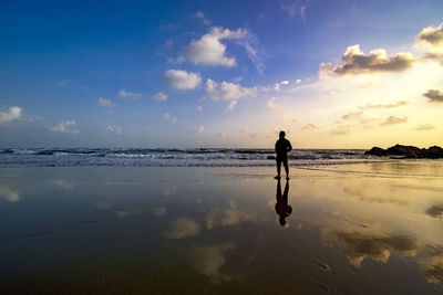 Full length of man on beach against sky