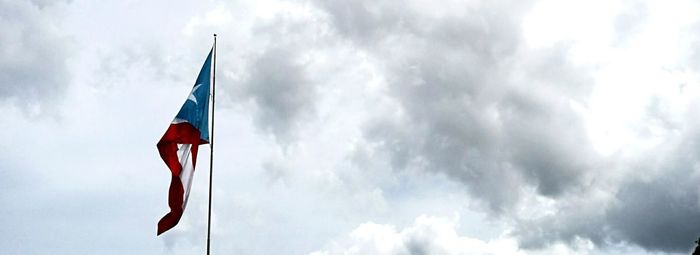 Low angle view of flag against sky