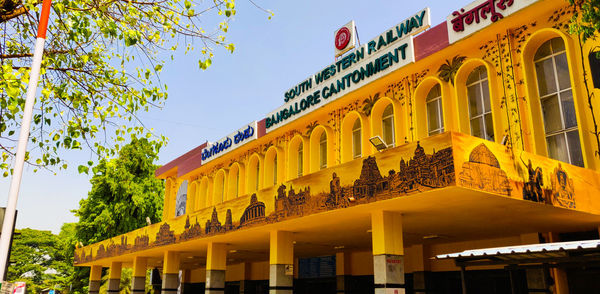 Low angle view of yellow building against clear sky