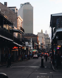 City street and buildings against sky