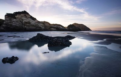 Scenic view of sea against sky during sunset