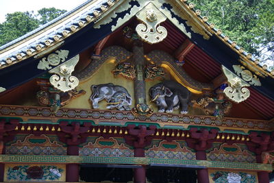 Low angle view of statue against building