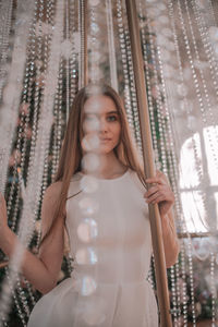 Portrait of woman in glass window