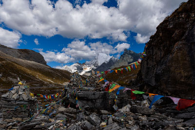 Scenic view of mountains against cloudy sky