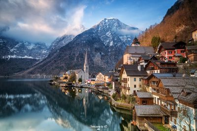 Panoramic view of buildings and mountains against sky