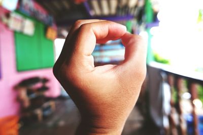 Cropped hand of person gesturing in balcony