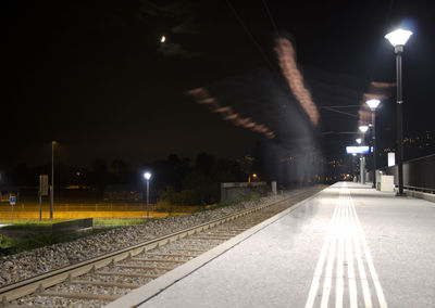 View of railway tracks at night