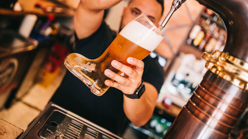 Close-up of a man drinking glass