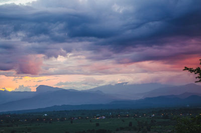 Scenic view of mountains against sky during sunset