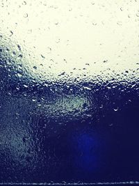 Close-up of water drops on glass