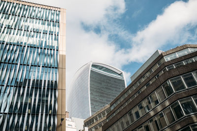 Low angle view of modern buildings against sky