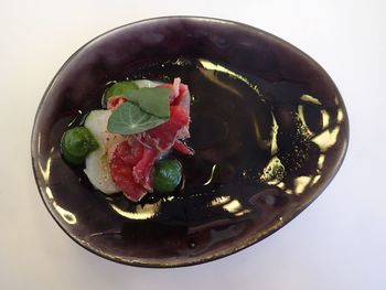 High angle view of fruit salad in bowl on table