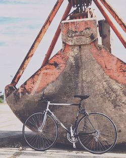 Bicycle parked against sky