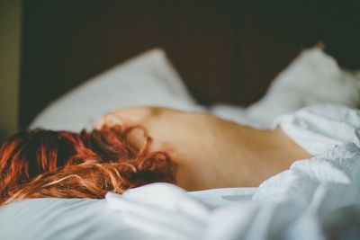 Woman sleeping on bed