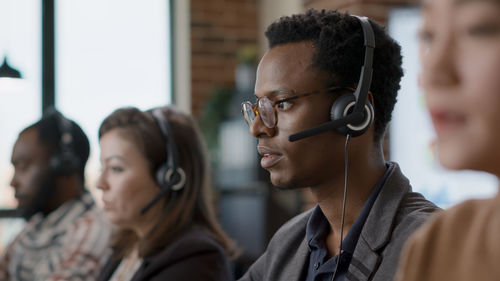 Male salesman talking on headset