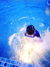 Man swimming in pool