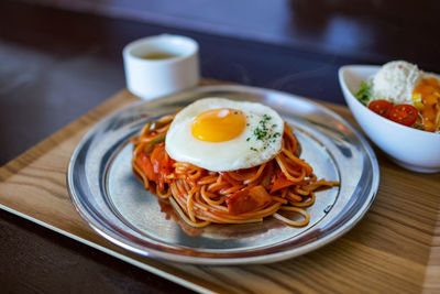 Spaghetti eaten at the counter of a coffee shop