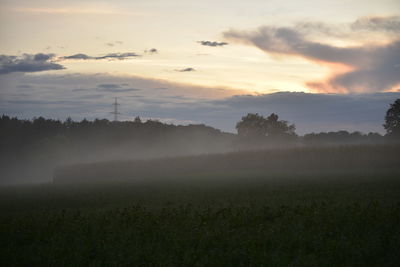 Scenic view of landscape against sky during sunset