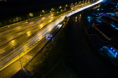 High angle view of light trails on road at night