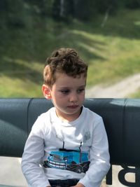 Cute boy relaxing in vehicle