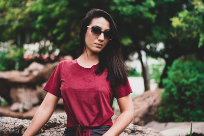 Young woman wearing sunglasses standing outdoors