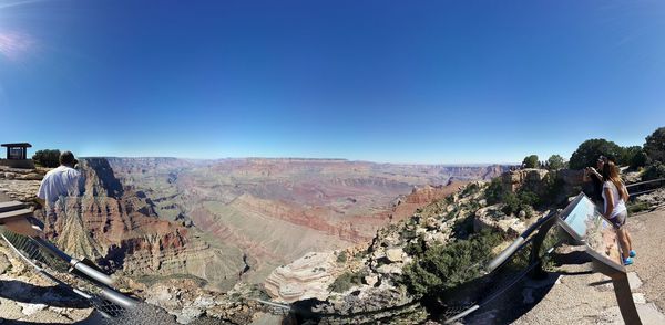 Scenic view of landscape against blue sky