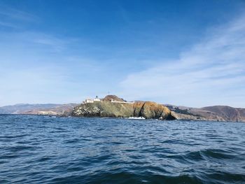 Scenic view of sea against blue sky