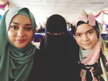 Portrait of siblings wearing hijab