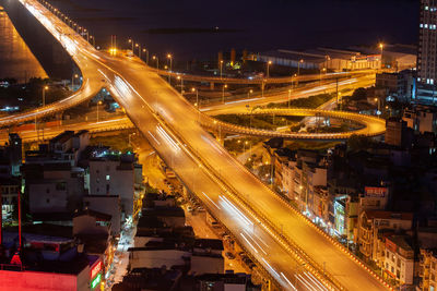 High angle view of light trails on city street at night