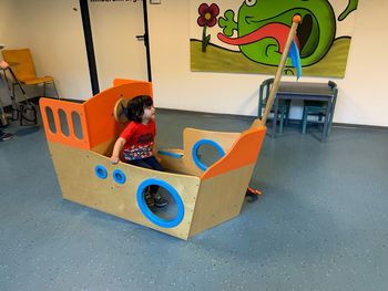 Boy playing with toy car