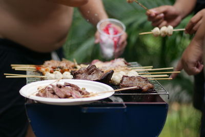 Midsection of man preparing food